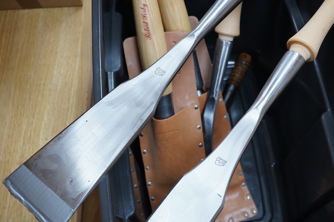 Seven timber framing chisels and slicks by Robert Sorby, Barr of Idaho U.S.A., etc. including two Sorby chisels in leather pouches, largest 86mm, a set of four Barr chisels, and another